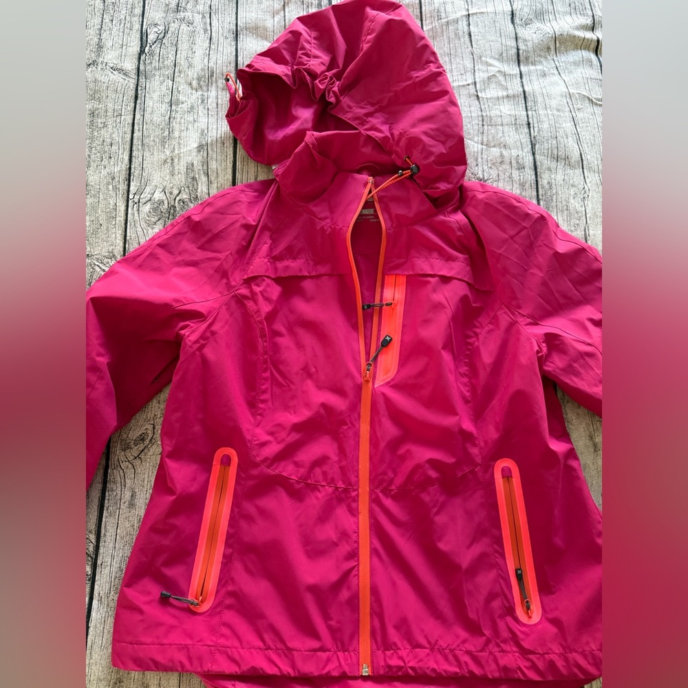 NWOT. Outer shell ski jacket or raincoat. No tags, new condition. Hot pink color